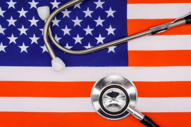 Patriotic Healthcare: A High-Quality Image of a Stethoscope on the American Flag Representing the Intersection of National Pride and Medical Excellence