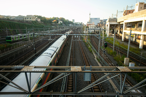 Tokyo, Japan; 1st October 2023: Trains passing through Nippori train station in Tokyo.