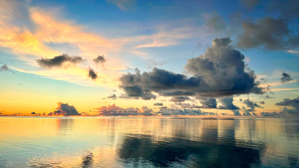 istock At the ocean in sunset on sunny Maldive island. 1897186468