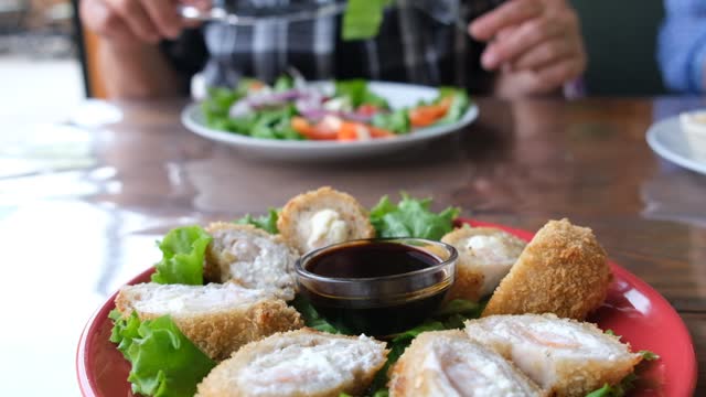 Fried hot rolls stuffed with cream cheese and salmon, crab and eel paste