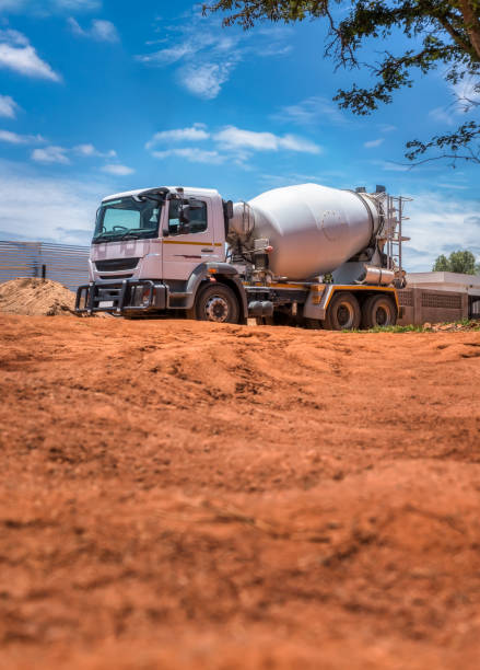 istock concrete mixer truck going on the construction site 1897242987