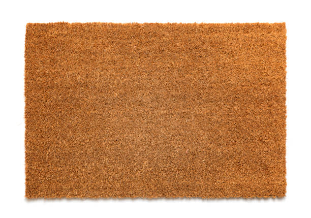 Natural brown coconut fiber doormat Natural brown coconut fiber doormat. Plain natural dry carpet on white background palm fiber stock pictures, royalty-free photos & images