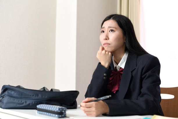 istock Profile of an Asian female student studying while worrying 1897306190