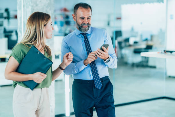 istock Business colleagues talking in the office 1897327000