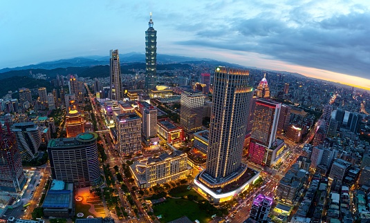 Panoramic aerial view of Downtown Taipei City at dusk, with landmark towers  in Xinyi Commercial District ~A romantic evening in Taipei, capital city of Taiwan, with dramatic rosy afterglow in the sky