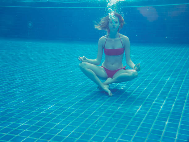 istock young beautiful woman in swimming pool 1897367801