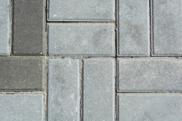 istock Grey concrete paving slabs. Texture of gray paving slabs. 1897385970