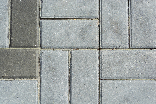 Gray concrete paving slabs. Pattern and Texture of gray paving slabs. Top view.