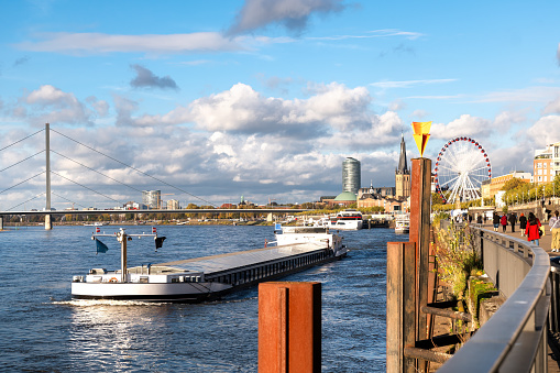 Cityscape of Düsseldorf with promenade and city beach on a sunny day in autumn, Germany