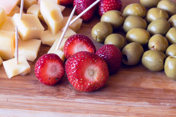 istock cheese, strawberries, and olives 1897394268