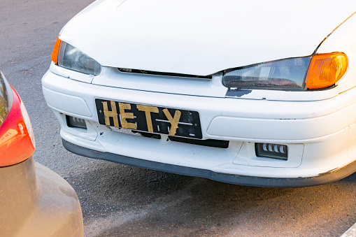 Voronezh, Russia - 15 October 2023: The inscription is not in Russian instead of license plates. concept of hiding car license plate number. close-up