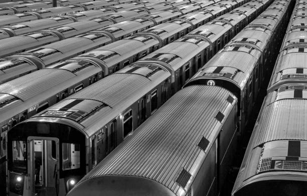 trains inside train yard (black and white photo) queens (mets willets point stop in corona flushing meadows queens) modern subway rail cars (7 line train car, commute, travel, commuter, metro) trains inside train yard (black and white photo) queens (mets willets point stop in corona flushing meadows queens) modern subway rail cars (7 line, commute, travel, commuter, metro) storage abstract train station black and white stock pictures, royalty-free photos & images