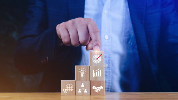 istock Hand arranging wood block stacking with business strategy and Action plan, targeting the business concept. Business development concept. Goal plan action. 1897502345