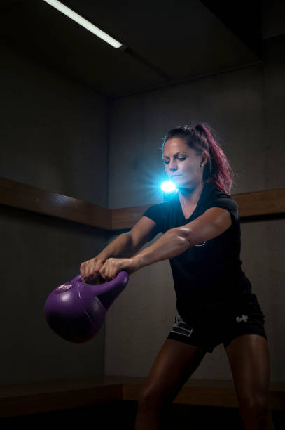 istock Medium shot of female handball player training with a kettlebell 1897502856