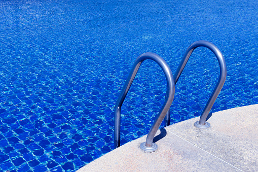 Swimming pool. Summer rest. Blue water. Backyard