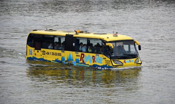 Budapest, Hungary - April 13, 2014: An amphibious tourist bus operated by River Ride transporting passengers across the Danube in Budapest, Hungary.
