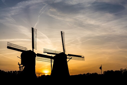Silhouette during sunset of the 2 windmills van de Polder Westbroek and van de Polder Buitenweg in Oud Zuilen, Utrecht, The Netherlands