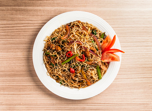 stewed rice vermicelli with pickled cabbage and shredded duck served in dish isolated on table top view of hong kong food