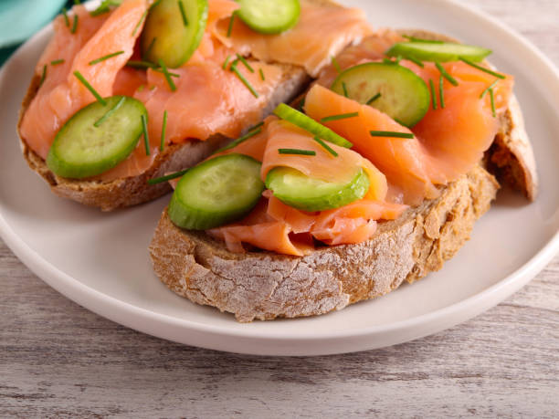 istock salmon with cucumbers over slices of brown bread 1897614062