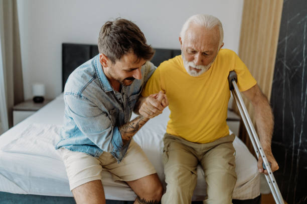 Son helping his father Son helping his father after hip replacement surgery hip replacement stock pictures, royalty-free photos & images