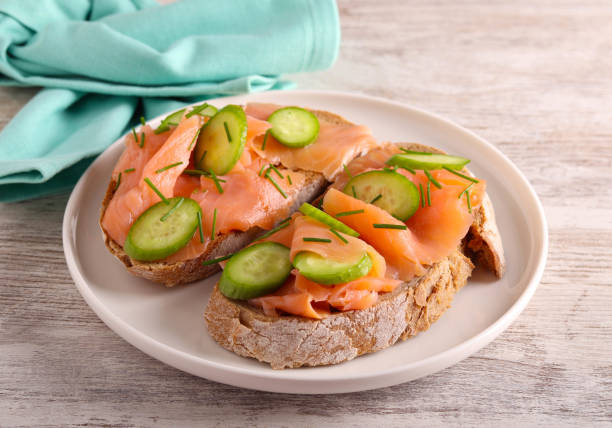 istock salmon with cucumbers over slices of brown bread 1897614307