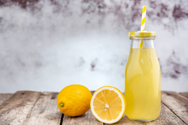 istock Fresh lemonade in glass bottle 1897630991