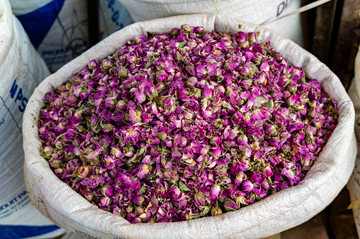 Sack full of dried rose buds in a market in Morocco.