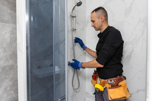 istock Plumber installing a shower cabin in bathroom 1897806054