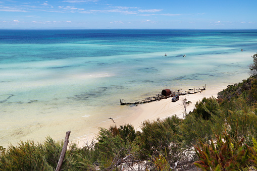 Moreton Island resides off the coast of southeastern Queensland, Australia. The sand island is best known for its beaches, clear blue water, aquatic wildlife, diving sites, steep sand dunes and dolphin feeding.