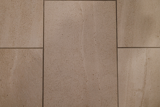 Tan Retro Sandstone tiles Textured Background with brown grout lines