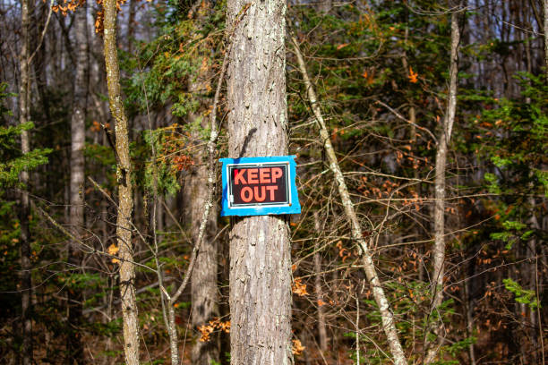 istock Wisconsin forrest with a keep out sign posted on a tree. 1897952271