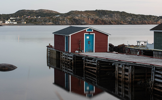 Wooden wharf reflecting on the water in Twillingate  Newfoundland