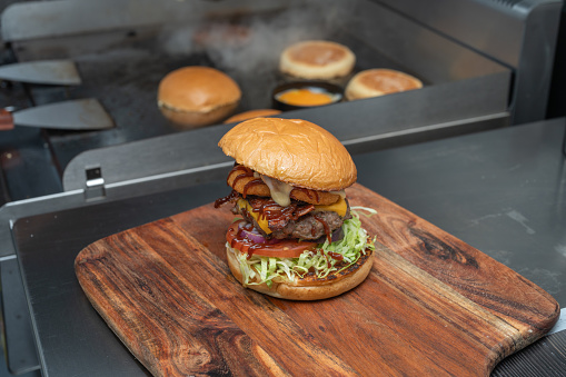 beef burger with cheese and onion ring