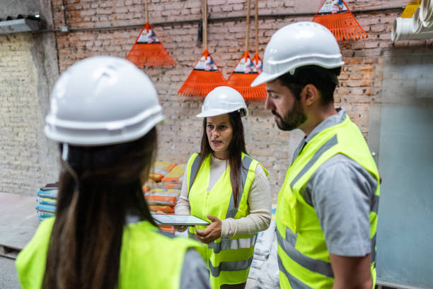 istock Coworkers talking at a construction site 1898161066