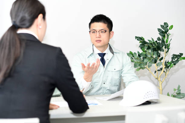 Asian office worker wearing work clothes and having a meeting in the office
