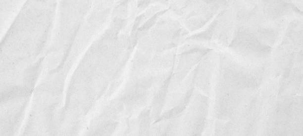 istock Abstract white crumpled and creased recycle paper texture background 1898202081