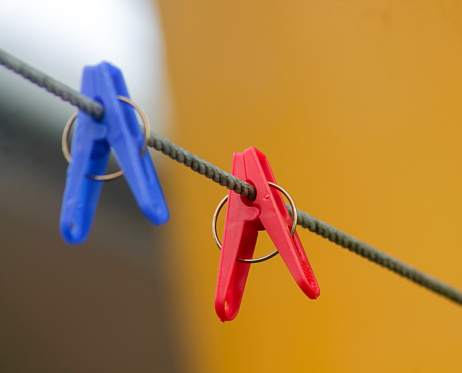 multi-colored plastic clothespin on rope