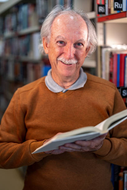 istock Friendly Caucasian Man  Smiling At The Camera At The Library 1898247272