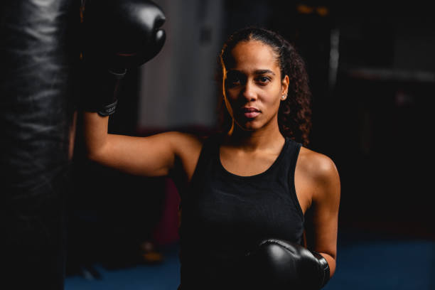 istock Serious Young Hispanic Female Boxer In A Training Session 1898249428