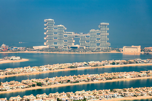 Dubai, United Arab Emirates - December 1, 2020: The Pointe dining and leisure area at Palm Jumeirah island overlooking the Atlantis hotel in Dubai on a blue sky morning in the UAE