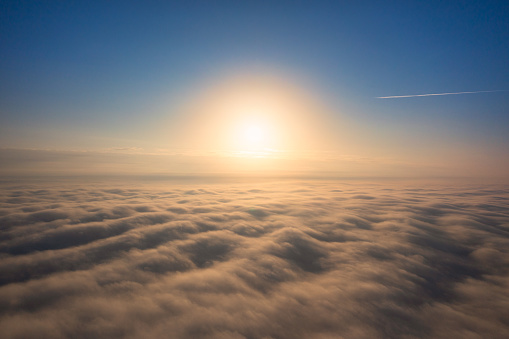 Astral Awakening: Witnessing Dawn's Magic Above the Cloudscape