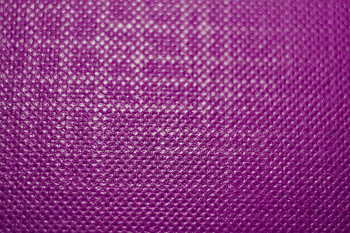 Lines intersect like a crossword puzzle on a purple, textured background, creating geometrical shapes.  The pattern is stronger on the left and top, but less to the right and on the bottom.