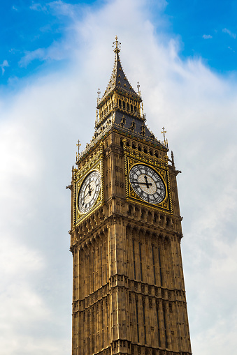 Close up of Big Ben clock tower against cloudy sky in London in a beautiful summer day, England, United Kingdom