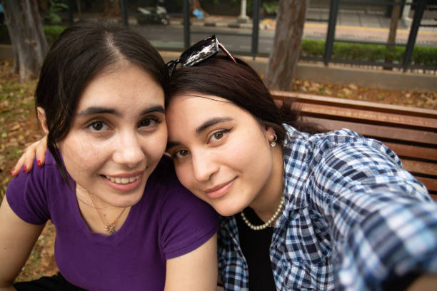 istock Two White Women Taking Selfie at Public Park on a Sunny Day 1898526897