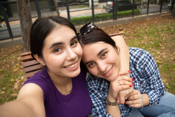 istock Two White Women Taking Selfie at Public Park on a Sunny Day 1898527407