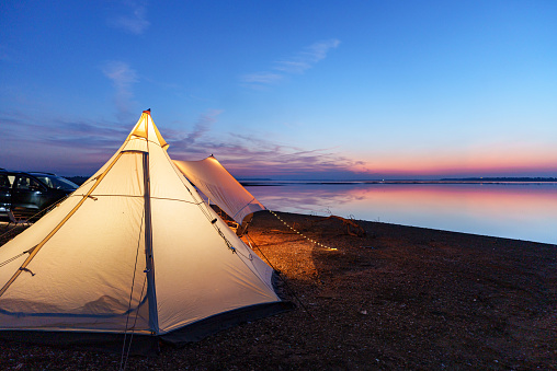 Outdoor camping scene at sunset