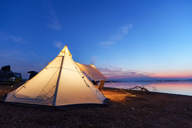 Outdoor camping scene at sunset