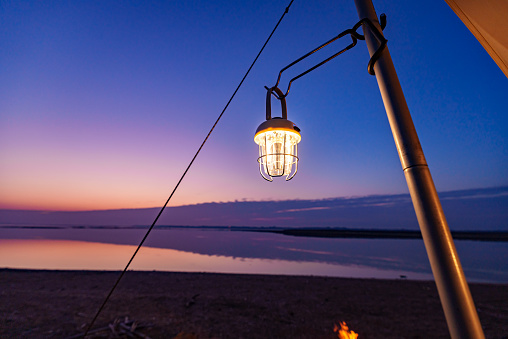 Camping lamps at sunset