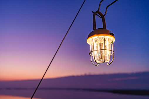 Camping lamps at sunset