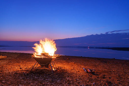 Outdoor bonfire at sunset